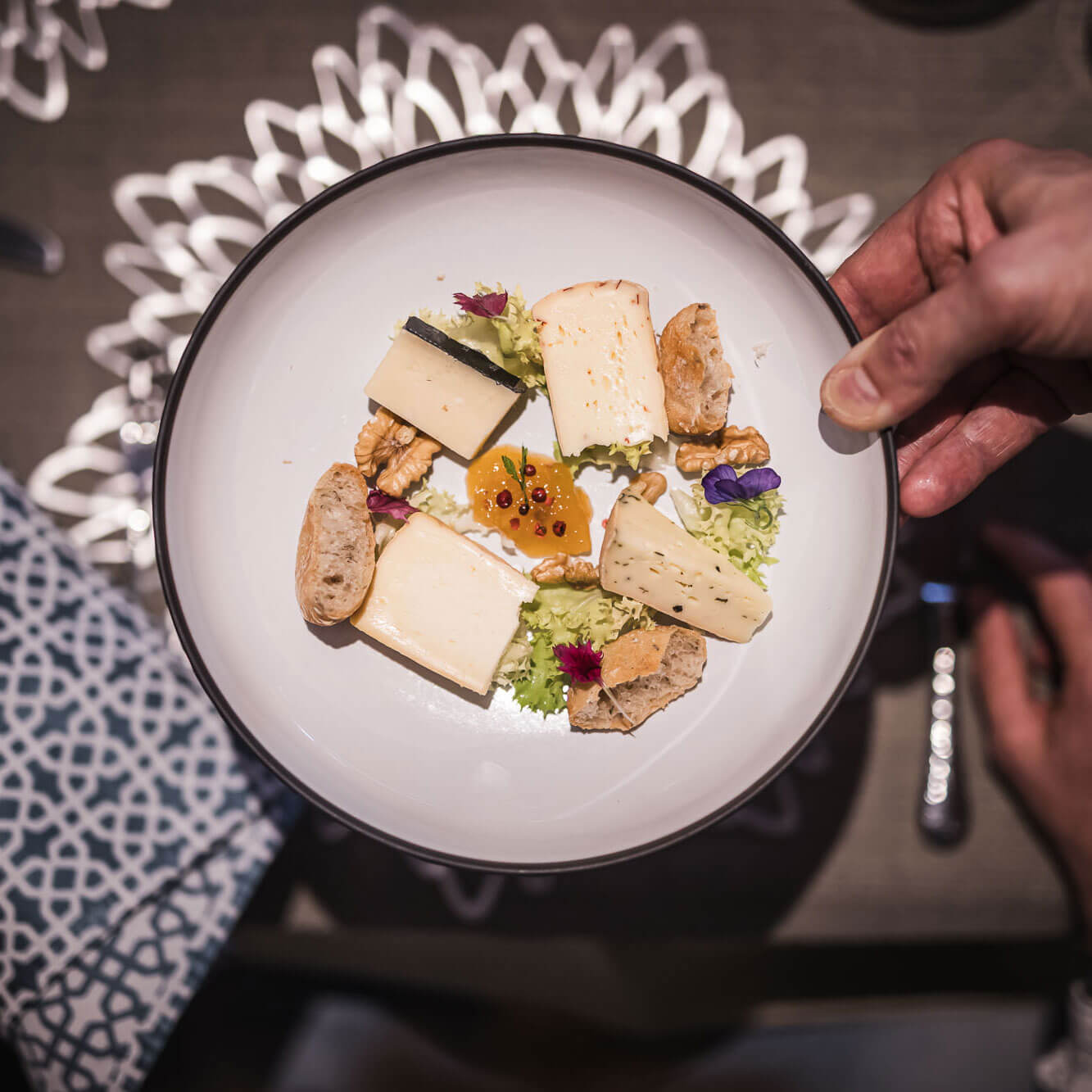 Food for connoisseurs - Cheese, bread & nuts on plates - Hotel Terentnerhof