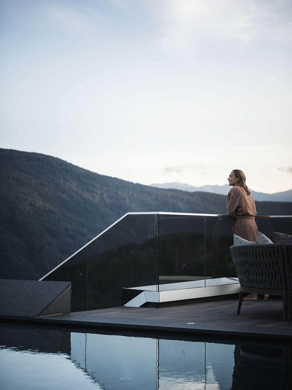 Woman enjoying the view on the sun terrace - Hotel Terentnerhof