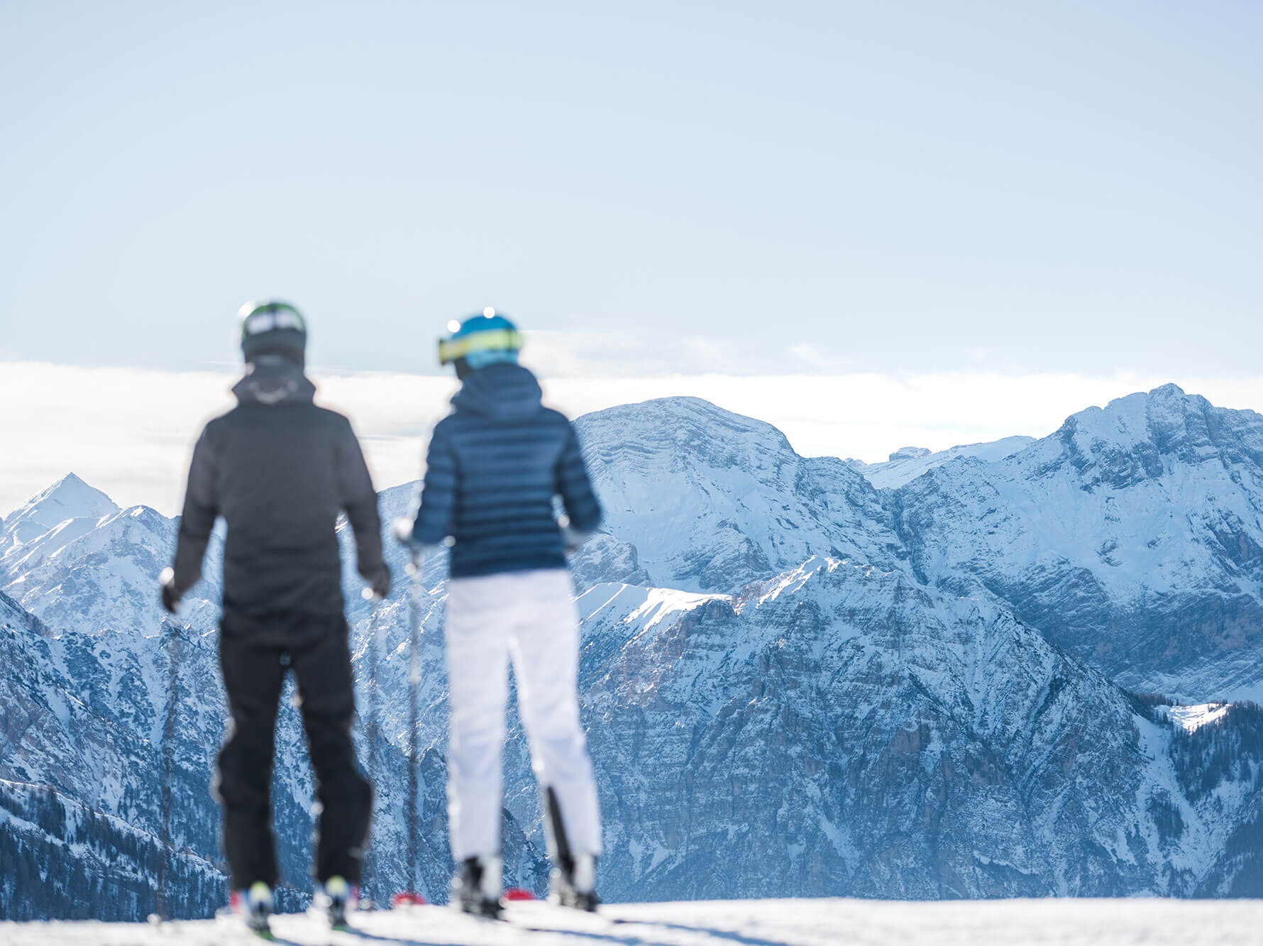 Plan de Corones ski resort - man & woman in front of a wintry mountain background - Hotel Terentnerhof